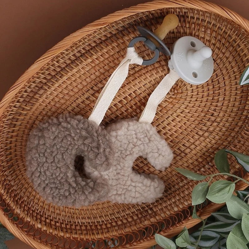 Plush moon pacifier holder